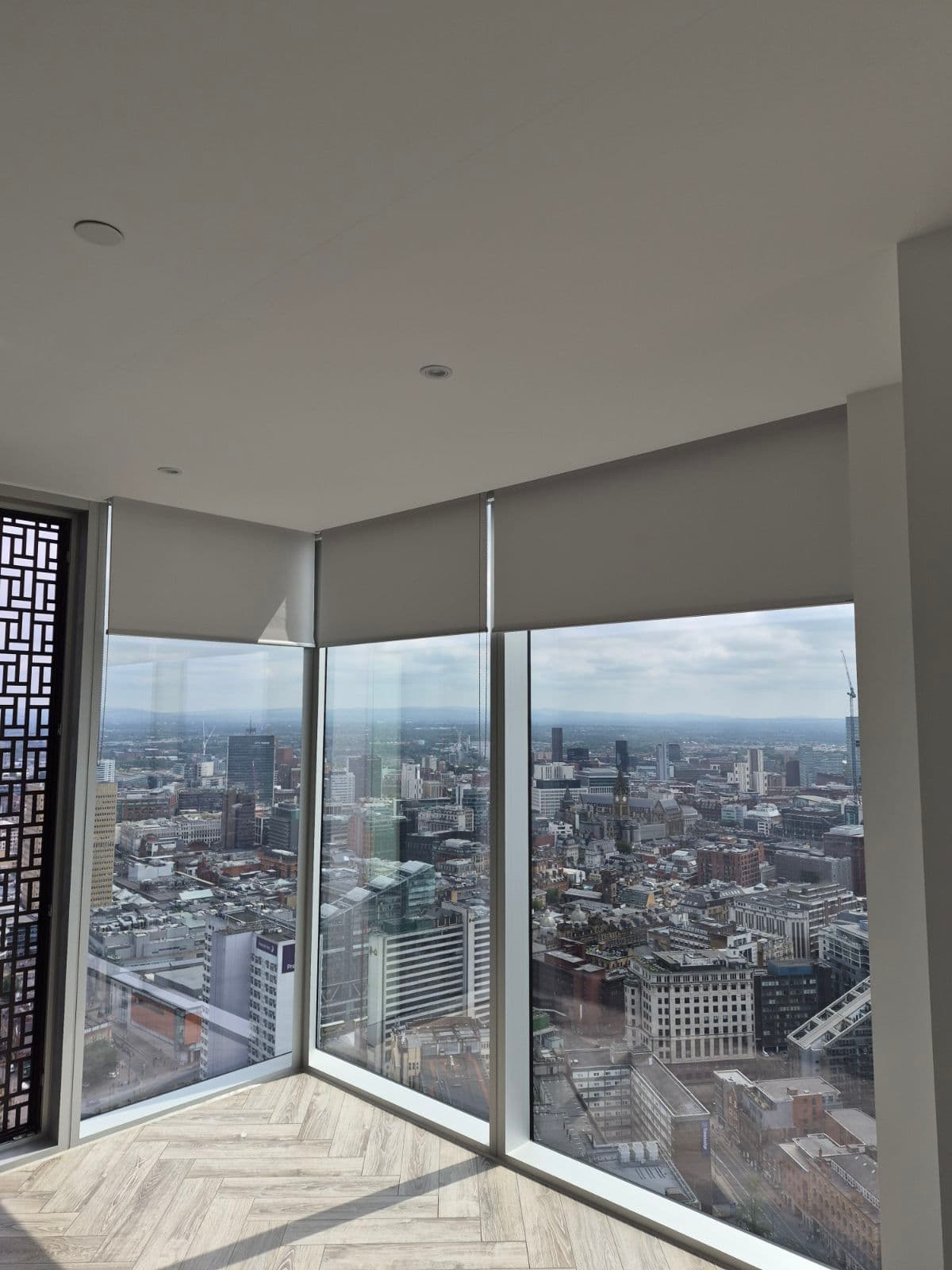 Buroshade roller blinds installed across a commercial city-view space